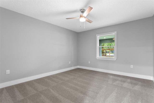 unfurnished room featuring ceiling fan, a textured ceiling, and carpet