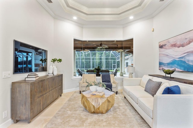 living room with ornamental molding, a towering ceiling, ceiling fan, and light tile patterned floors