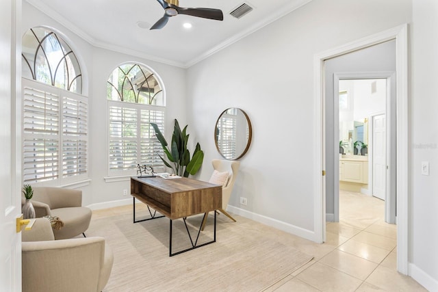 office space featuring ceiling fan, crown molding, and light tile patterned floors