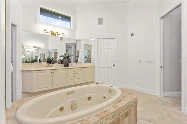 bathroom featuring crown molding, tiled bath, a towering ceiling, and vanity