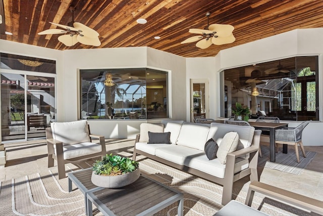 view of patio with outdoor lounge area and ceiling fan