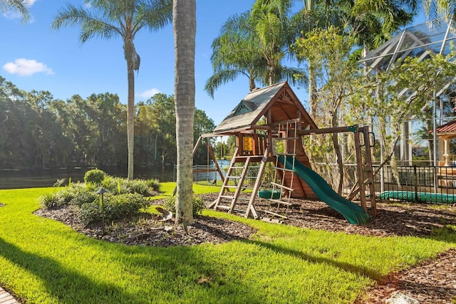 view of jungle gym with a lawn