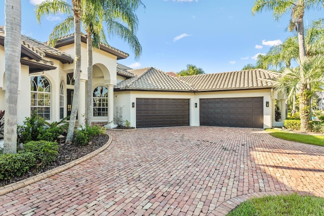 mediterranean / spanish-style house featuring a garage