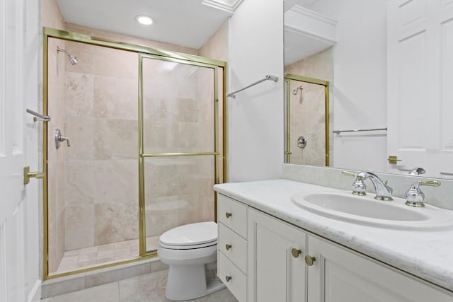 bathroom featuring tile patterned floors, an enclosed shower, vanity, and toilet