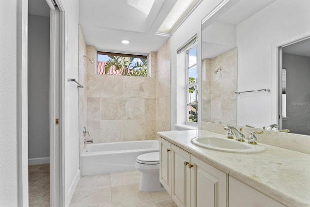 full bathroom with vanity, toilet, tile patterned floors, and tiled shower / bath