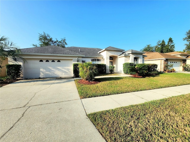 ranch-style house with a garage and a front yard