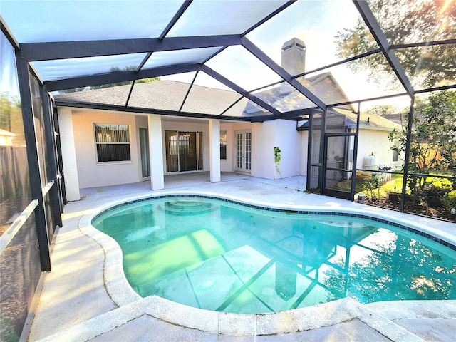 view of pool with a patio and a lanai