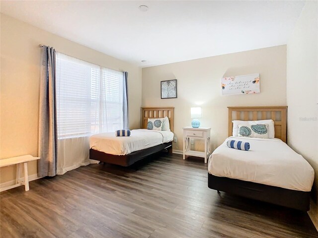 2705 Bushman Dr, Kissimmee, FL 34746 - bedroom with wood finished floors and baseboards