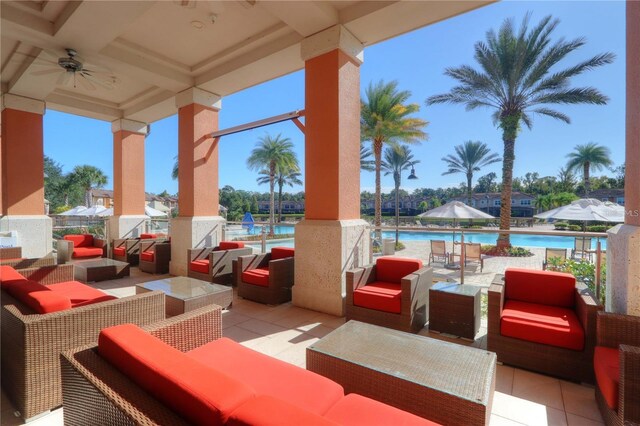 2705 Bushman Dr, Kissimmee, FL 34746 - view of patio featuring outdoor lounge area, a community pool, and a ceiling fan