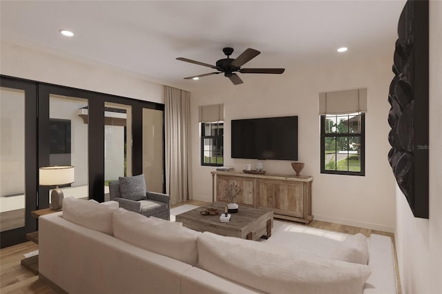 living room featuring ceiling fan and light wood-type flooring