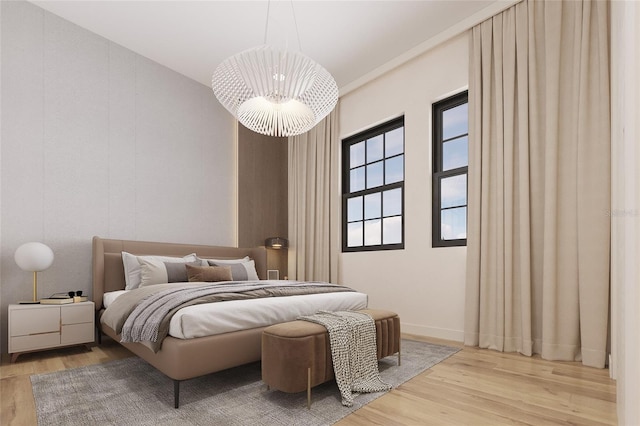 bedroom featuring a chandelier and light wood-type flooring