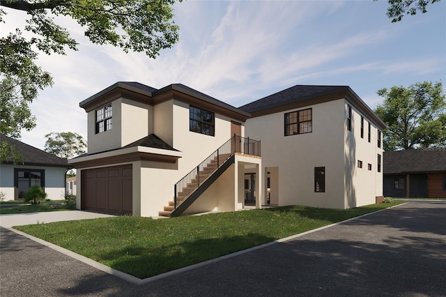 view of front of house featuring a garage and a front yard