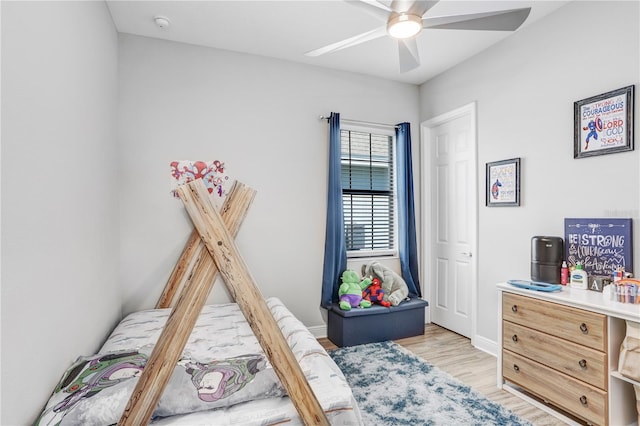 bedroom with ceiling fan and light hardwood / wood-style flooring