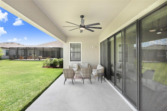 view of patio / terrace featuring a lanai and ceiling fan