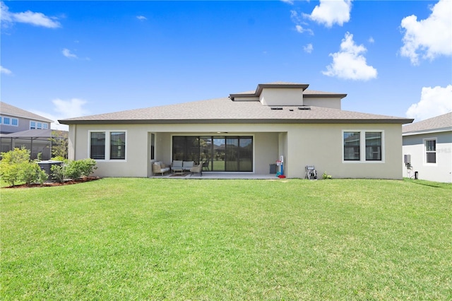 rear view of house with a patio and a yard