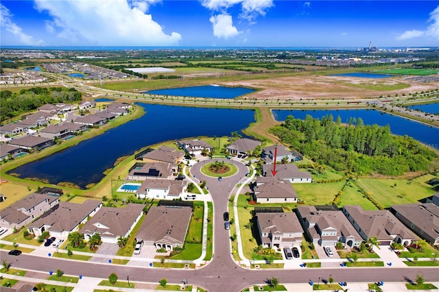 birds eye view of property featuring a water view