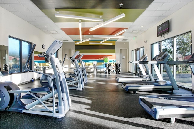 workout area featuring a drop ceiling