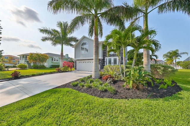 view of front of home featuring a front lawn and a garage