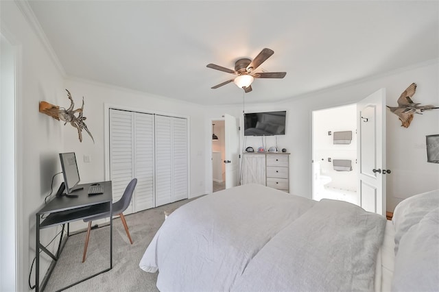 carpeted bedroom featuring crown molding, a closet, and ceiling fan