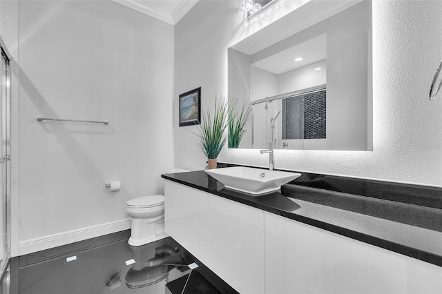 bathroom featuring vanity, toilet, an enclosed shower, and crown molding