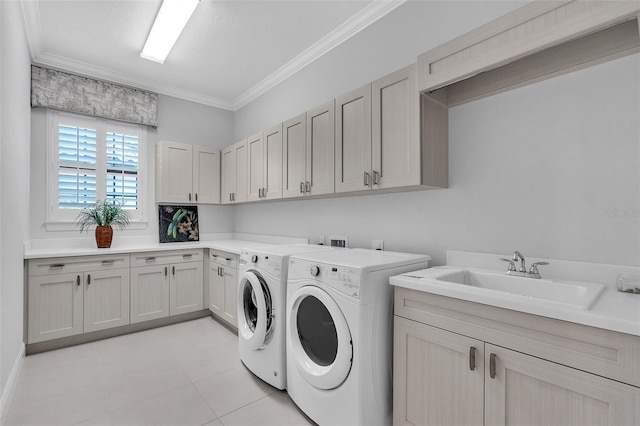 washroom with cabinets, crown molding, sink, independent washer and dryer, and light tile patterned flooring