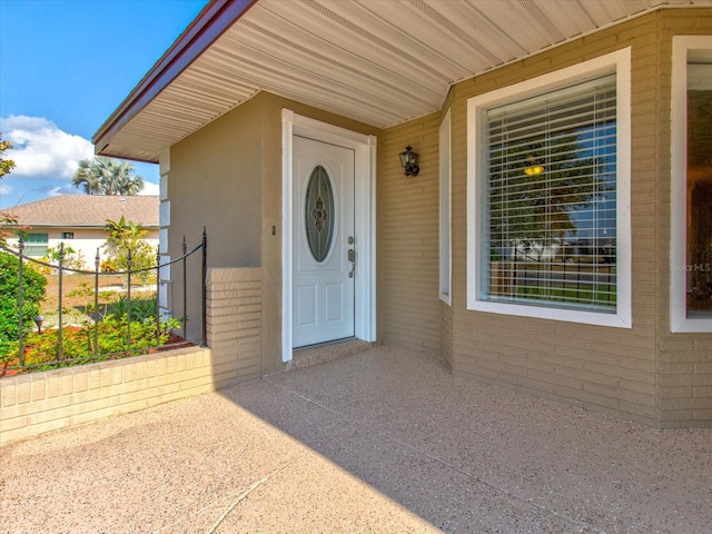 doorway to property featuring a patio area