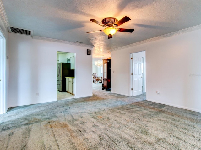 unfurnished room featuring crown molding, a textured ceiling, carpet floors, and ceiling fan with notable chandelier