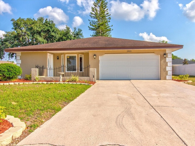 ranch-style home featuring a garage and a front yard