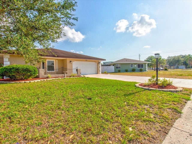 single story home featuring a garage and a front lawn