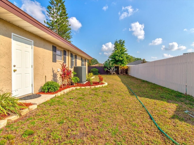 view of yard featuring central AC