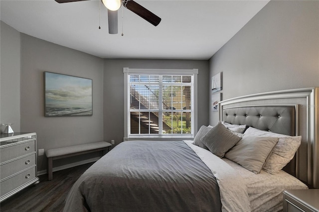 bedroom with ceiling fan and dark hardwood / wood-style flooring