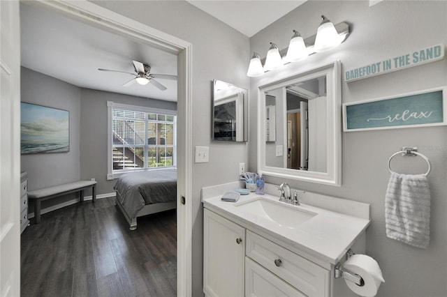 bathroom featuring hardwood / wood-style floors, vanity, and ceiling fan