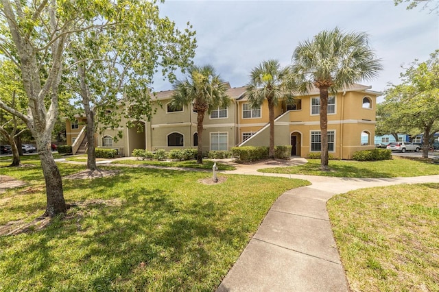 view of front of home with a front lawn