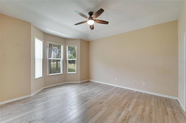 spare room with ceiling fan and light hardwood / wood-style floors