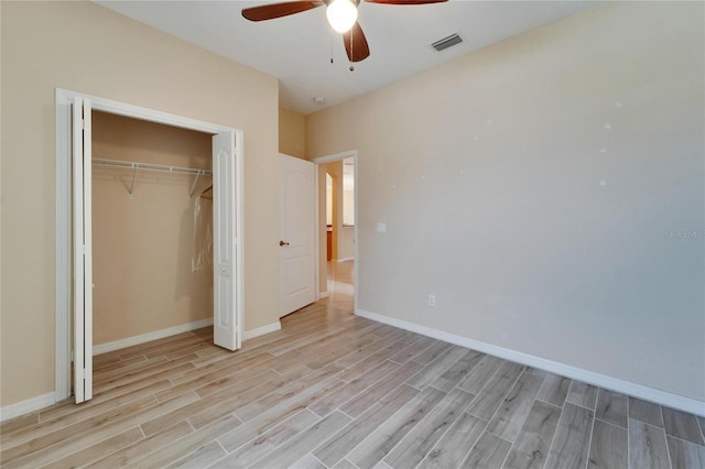 unfurnished bedroom with a closet, ceiling fan, and light wood-type flooring