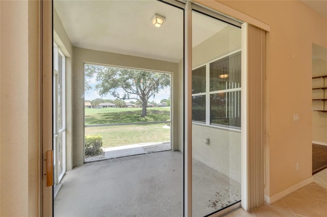 doorway with light tile floors