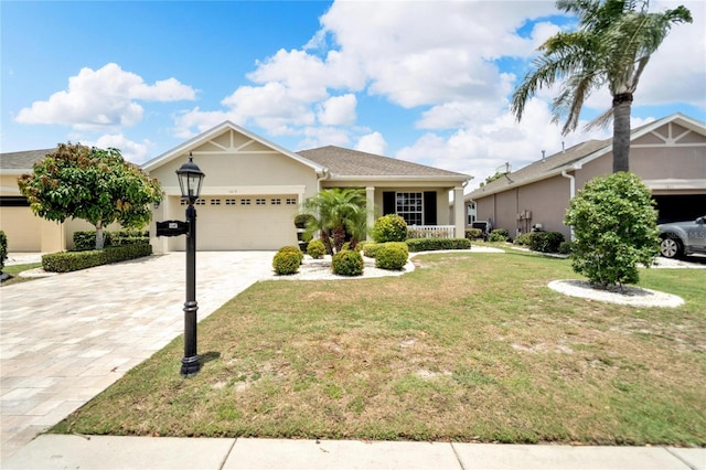 view of front of house featuring a front yard and a garage