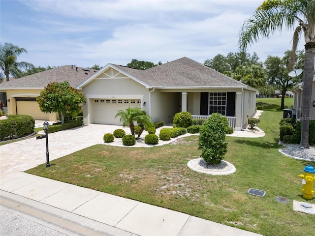 ranch-style home featuring a garage and a front yard