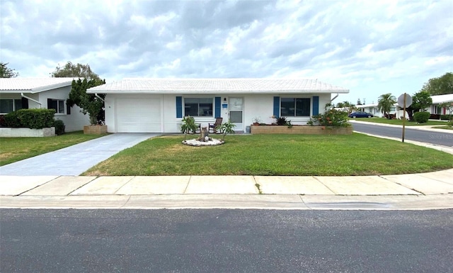 ranch-style house with a garage and a front yard