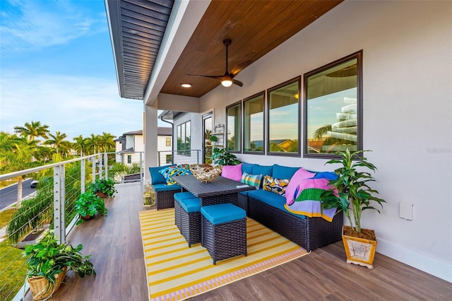 balcony featuring ceiling fan and an outdoor living space