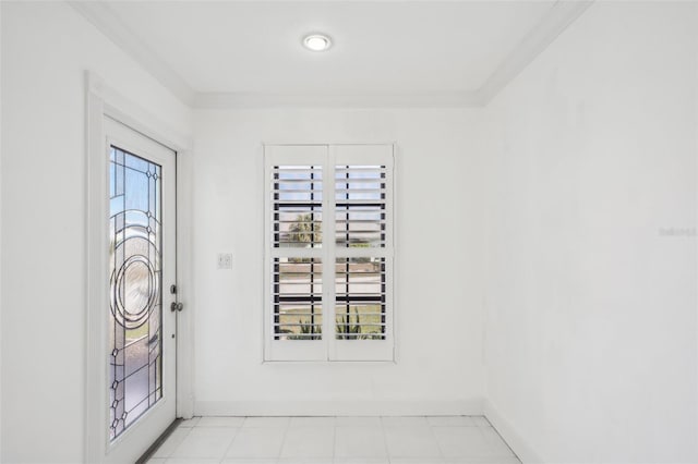 entrance foyer with ornamental molding and baseboards