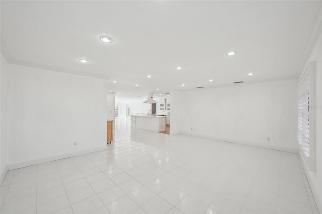 unfurnished living room featuring baseboards and recessed lighting