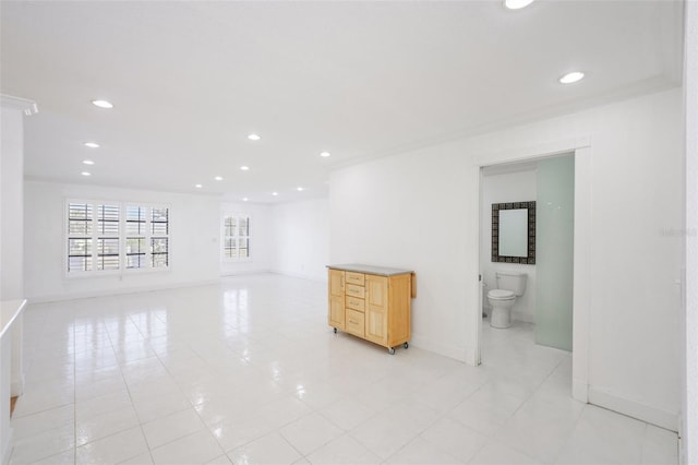 empty room with recessed lighting, light tile patterned flooring, and baseboards