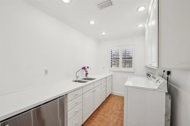 laundry room featuring cabinet space, visible vents, independent washer and dryer, a sink, and recessed lighting