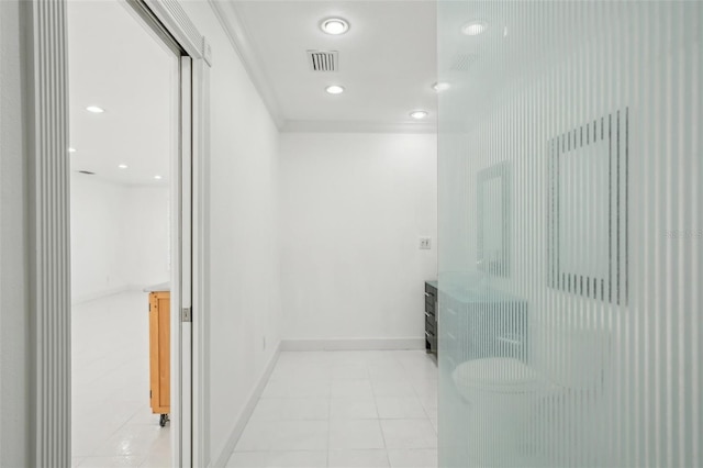 corridor featuring recessed lighting, baseboards, visible vents, and light tile patterned flooring