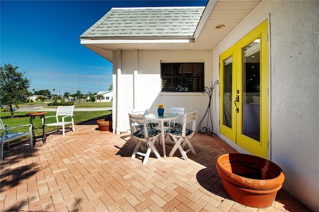 view of patio / terrace featuring french doors and outdoor dining area