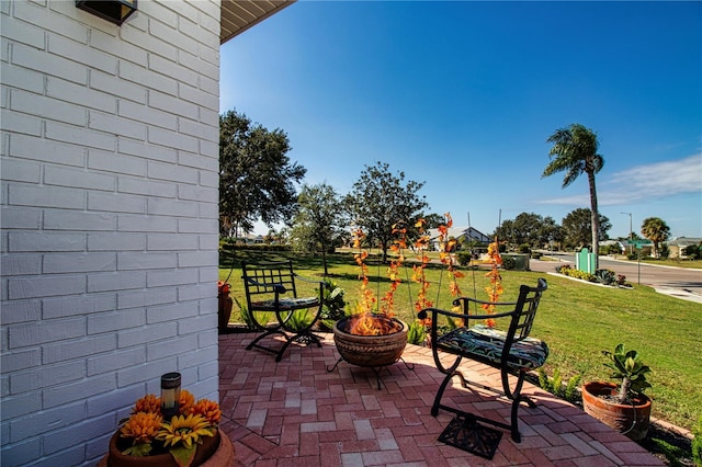 view of patio featuring a fire pit