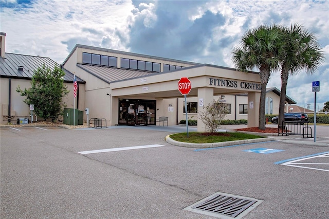 view of property featuring uncovered parking