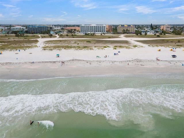 birds eye view of property featuring a view of the beach and a water view