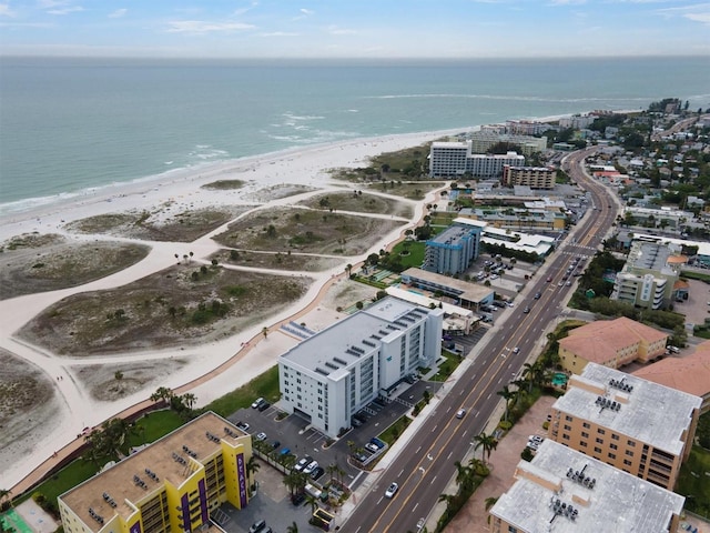 birds eye view of property featuring a view of the beach and a water view